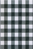 Black and white checkered pattern on a fabric background