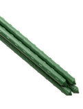 Two green metal stakes on a white background