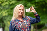 Woman holding THE LILY GARDEN 5 oz. ~ FARM TO TABLE SOAP SLICE outdoors with greenery in the background