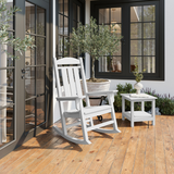 White Callaway Porch Rocker on a wooden deck with a house in the background