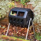 Black compost bin with food waste in a garden setting