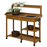 Wooden potting bench with shelves, drawers, and plants on a white background
