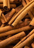 Close-up of cinnamon sticks on a woven surface Cassia Cinnamon (Cinnamomum cassia)