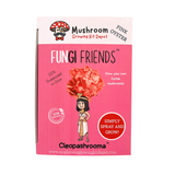 Pink packaging of Fungi Friends mushroom growing kit with cartoon character and text.