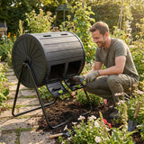 Man in a garden using a compost bin