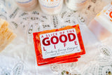 Bar of soap with 'A Slice of the Good Life' packaging on a textured surface