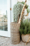 Rattan Round Umbrella Stand on a patio