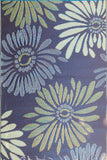 Floral patterned fabric with blue, green, and white flowers on a dark blue background