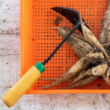 EZ-Digger Garden Tool Short Handle | 7 inch Blade on an orange background with root vegetables.