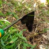 EZ-Digger Garden Tool Short Handle | 7 inch Blade digging into soil with grass and plants around