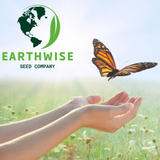 Earthwise Seed Company logo with hands holding a butterfly over a grassy field
