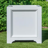 White rectangular Eastover planter with decorative frame on grass