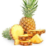 Whole pineapple and slices on a white background