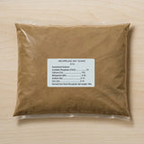 Brown package of Archipelago Bat Guano with a label on a wooden surface