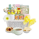Planted With Love Cookies & Tea Gift Basket Tea gift basket with tea bags, cookies, and a cup of tea on a white background