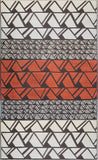 Geometric patterned rug with triangles in red, gray, and white.