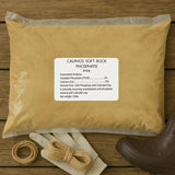 Brown bag labeled 'Calphos Soft Rock Phosphate' on a wooden surface with a boot and twine.