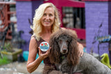 Woman holding a dog and THE FARMERS GARDEN 8 oz. ~ FARM TO TABLE HAND CREAM