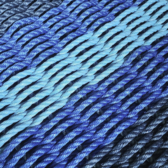 Close-up of blue and black rope on a wooden surface