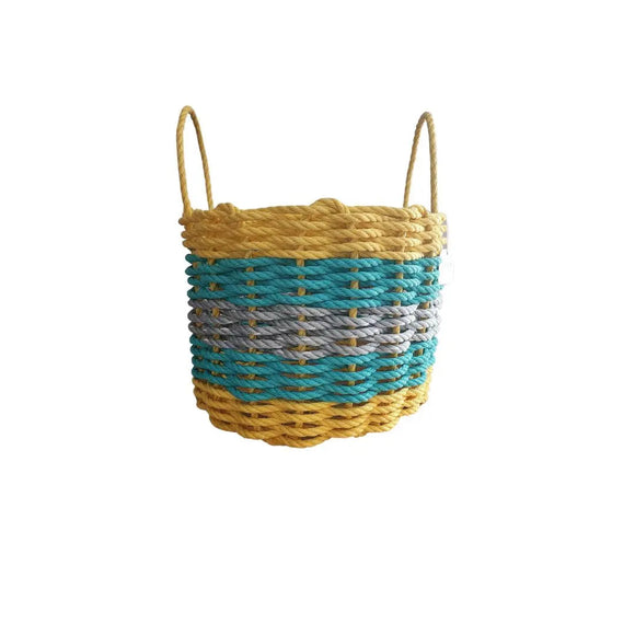 Woven basket with yellow top and blue and gray striped middle on a white background