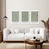 Living room with a white sofa, coffee table, and three William Morris prints on the wall.