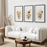 Modern living room with a white sofa, wooden coffee table, and Neutral Watercolor Wildflower Art Prints Set
