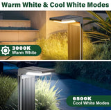 Outdoor solar light with warm white and cool white modes displayed on a garden setting.