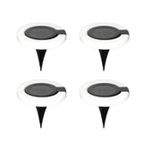 Four solar-powered LED light stakes on a white background