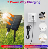 Solar panel charging outdoors with USB cable for indoor use, showing power sources.