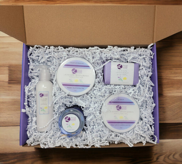 Set of skincare products in a box on a wooden surface