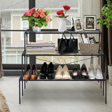 Outdoor 3 Tier Metal Plant Stand with Heavy Duty Rack for Multiple Use with shoes, handbag, and decor items in a home setting