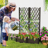 Woman and child watering plants in a garden with a decorative screen in the background
