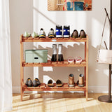 3-Tier Solid Wood Plant Stand with Slatted Shelves with various shoes on a light wooden floor.