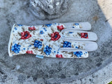 Floral-patterned glove on a textured surface Women's Floral Gardening and Project Gloves "The Caroline"