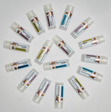 Multiple lip balm tubes with visible branding on a white background