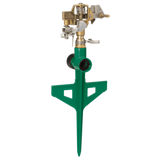 Green garden sprinkler with brass valve on a white background