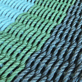 Close-up of blue and green  lobster rope mat with a gradient effect.