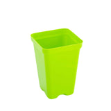 Green plastic pot on a white background