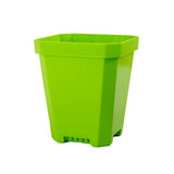 Green plastic pot on a white background