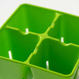 Close-up of a green 4 Cell Plug Tray Insert