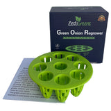 A lime green plastic multi-hole green onion regrower shown in front of its dark blue Zestigreens branded box, with a small instruction card partially visible underneath on a white background.