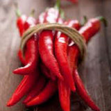Bunch of red chili peppers tied with twine on a wooden surface HOT PEPPER Seeds, Cayenne