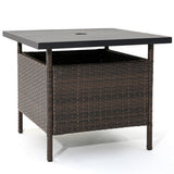 Outdoor table with wicker frame and black top on a white background