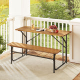 Wooden table and bench set on a balcony with a view of greenery.