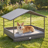 Dog lying on a wicker pet bed with canopy in a garden