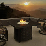 Henley 40" Round Aluminum Basketweave Convertible Gas Fire Pit Table with chairs on a patio during sunset with mountain views.