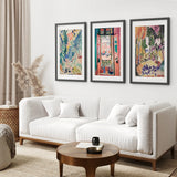 Modern living room with a white sofa, wooden coffee table, and colorful Henri Matisse Abstract Painting Wall Art Prints on the wall.