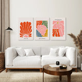 Modern living room with a white sofa, wooden coffee table, and Henri Matisse Flower Market Colorful Poster