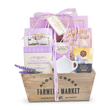 Gift basket with tea packages and a wooden box labeled 'Alde Creek Farmers Market' on a white background.