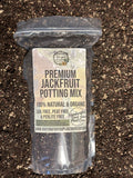 Bag of premium jackfruit potting mix on a soil background